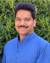 Dr. Jayarajan Kodikannath outdoors blue tunic_200x250