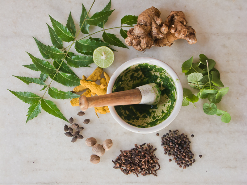 An aesthetic collection of herbs on a white table