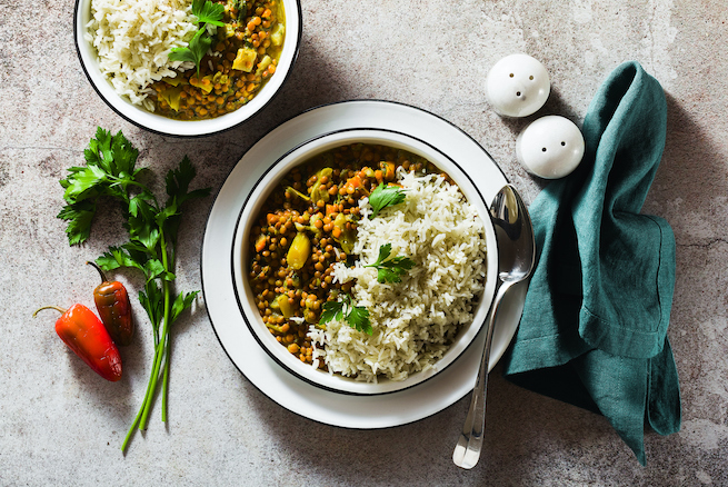 indian lentil dhal with vegetables and basmati rice on the table. healthy vegan Ayurvedic cuisine