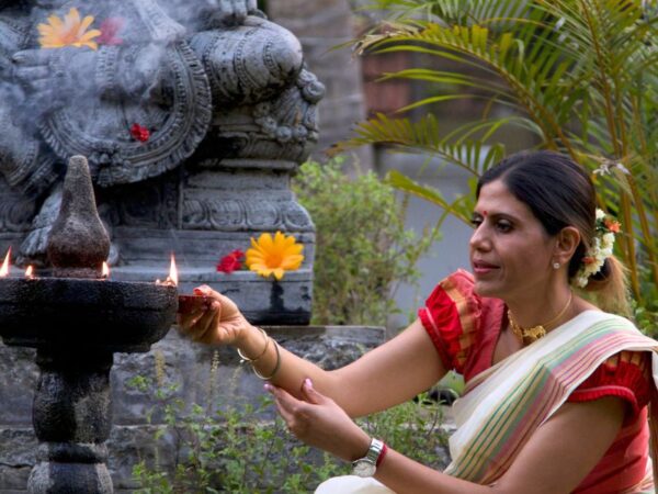 Lighting the vilakku at our award-winning Ayurvedagram resort in Bangalore, India