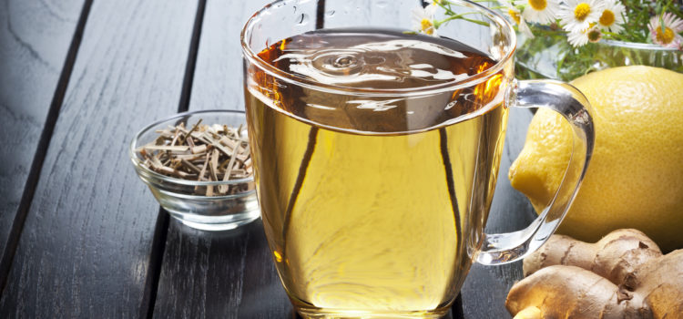 Clear glass cup with ginger and lemon tea