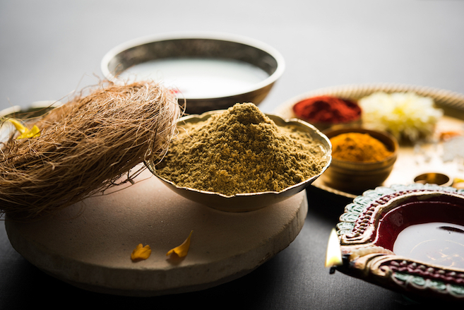 loose powder herbs displayed in silver dishes